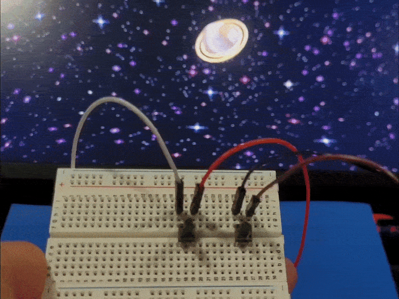 A video demo showcasing the two buttons on the breadboard controlling the mouse click and space key which are tied to a zoom in and zoom out function in p5 code.